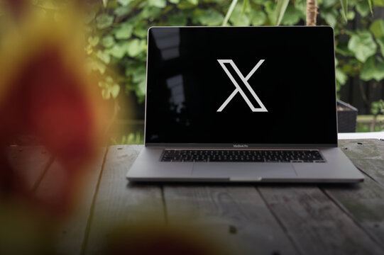 X logo, formerly Twitter, online social media and social networking service owned by Elon Musk, displayed on a MacBook Pro screen