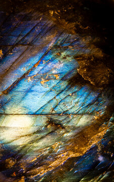 This is an extreme close up of a colorful labradorite stone.  I used special lighting to bring out the unique, luminous colors and cracked mineral textures.  