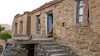 Ruined house in the old Greek village Tepeköy (Agridia) Turkish Aegean Island Gökçeada. Çanakkale, Turkey