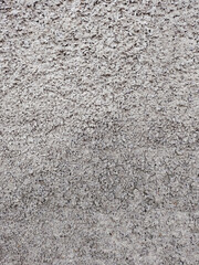 Regular and uniform speckled plaster wall. Cement. Texture.