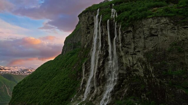 Seven Sisters Waterfall on the Geiranger fjord during a majestic and beautiful sunset, Norway