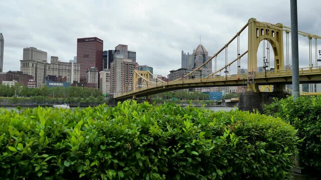 Drone moving higher up looking at the 7th street Roberto Clemente bridge and the city of Pittsburgh.