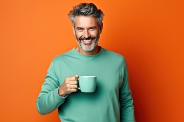 Happy man with cup of coffee