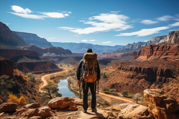 Fototapeta na wymiar Hiker observing a stunning canyon - stock photography