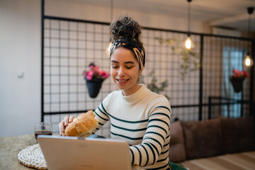woman beautiful young female sit at the kitchen table have breakfast