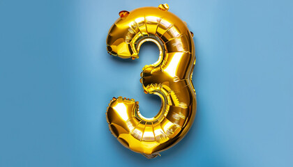 Banner with number 3 golden balloon with copy space. Three years anniversary celebration concept on a blue background.