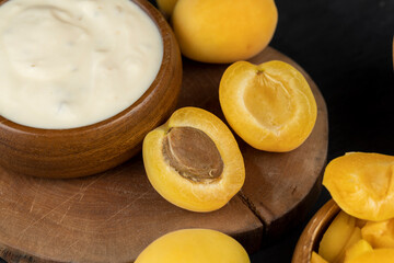 fresh yogurt with taste and chunks of yellow apricot