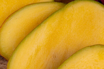 sliced orange pulp of ripe mango fruit