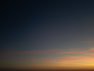 Amidst a serene backdrop, the dawn breaks, painting the horizon in myriad shades of pink. A drone captures this breathtaking ballet of nature from a bird's-eye perspective, revealing the world awakeni