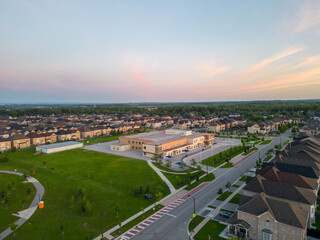 Fototapeta na wymiar Experience the epitome of Vaughan real estate through mesmerizing drone footage. Nestled by Major Mackenzie & Jane St, close to Highway 400, this area boasts architectural elegance amidst vibrant urba
