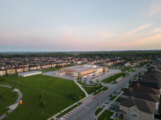 Fototapeta na wymiar Experience the epitome of Vaughan real estate through mesmerizing drone footage. Nestled by Major Mackenzie & Jane St, close to Highway 400, this area boasts architectural elegance amidst vibrant urba