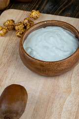 fresh yogurt with kiwi flavor and with pieces of fruit and popcorn