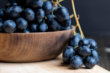 Unwashed blue grapes in the dust