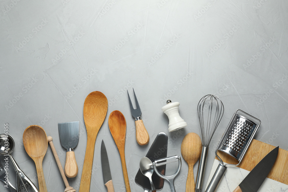 Poster set of kitchen utensils on light grey table, flat lay. space for text