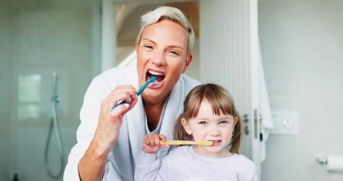 Face, mom and girl kid brushing teeth in home for hygiene, morning routine and learning healthy oral habits. Portrait of woman, child and dental cleaning with toothbrush for self care of fresh breath