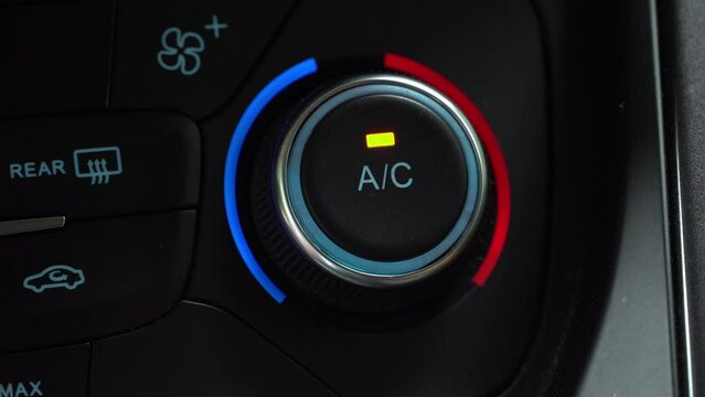 Turning on car climate control button in automatic mode of temperature control in cabin. Separate air conditioner in vehicle