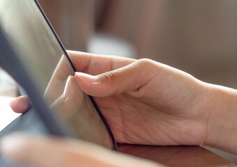 Close up finger, working on computer screen. Study or work online Concept.