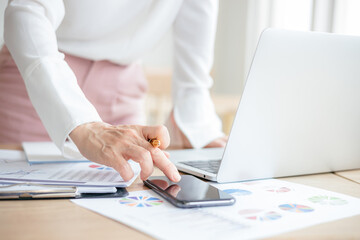 Asian Business woman discussion and analysis data at office