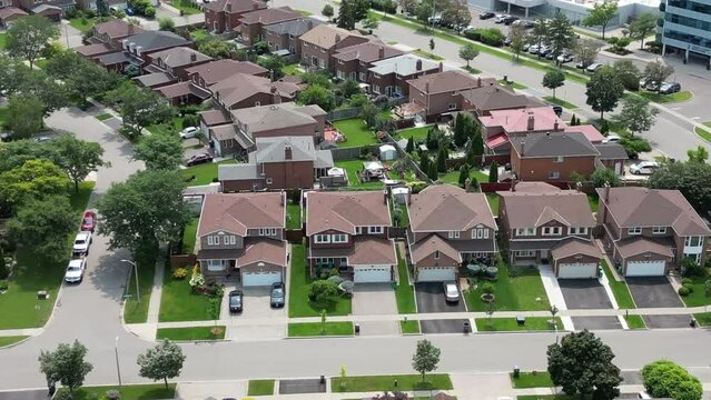 Experience a unique view of Brampton as a drone backs away from houses, revealing the broader landscape and architectural beauty of the neighborhood. 