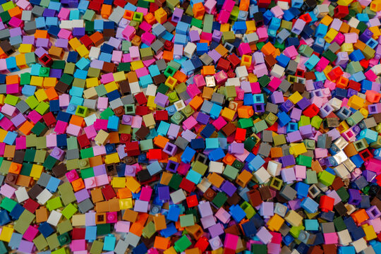 Selective focus at colorful heap of small pieces of lego blocks at Lego House in Billund, Denmark.
