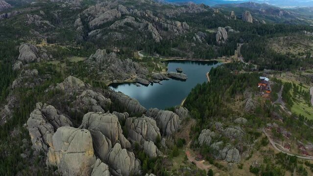 A lake reflects the blue sky in its secluded spot in the Black Hills of SD