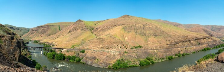 Panorama of the railroad tracks of the Oregon Trunk Subdivision crossing the Deschutes River near Grass Valley, Oregon, USA