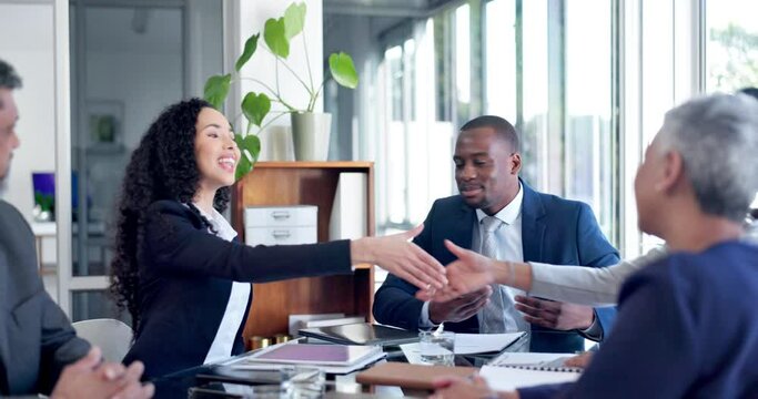 Handshake, welcome and arrive with a business woman meeting her new team in the boardroom at work. Management, collaboration and greeting with a professional employee group shaking hands in an office