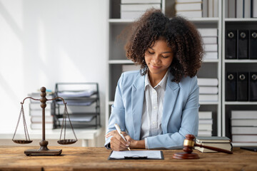American woman is legal litigation attorney, Female lawyer is in a law firm drafting contracts and...