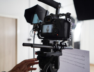 Professional photographer and video production on white background in the studio.