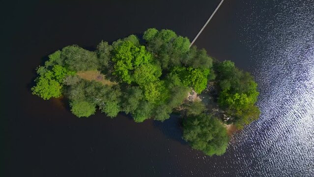 speed ramp Dramatic aerial top view flight 
Natural Summer Paradise idyllic Island in Lake, Chlum in Czech, day 2023. vertical bird's eye view drone
4K Cinematic