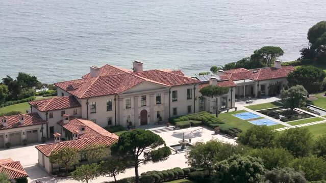 Aerial View Of Pacific Ocean Front Mansion In Malibu. Dolly Right