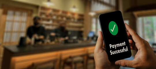 customer using a smartphone Online Money Transfer Confirmed at the cafe coffee Technology lifestyle payment screen a banking payment on a mobile phone