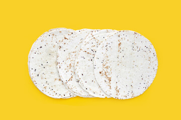 Quinoa tortilla wraps on yellow background