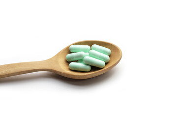 Medicine capsules on white background.