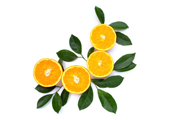 Orange fruit with green leaves on white background.