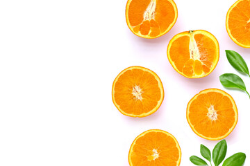 Orange fruit with green leaves on white background.