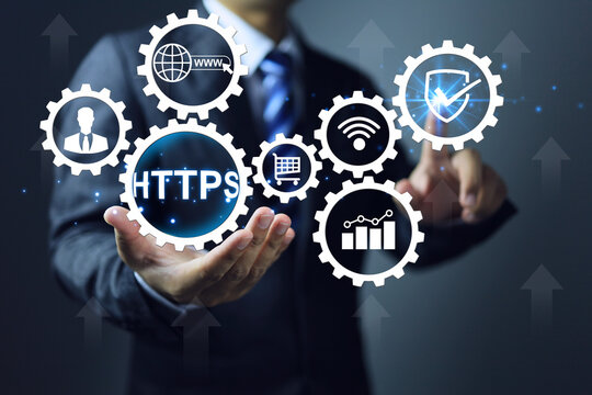 Business website domain url https more secure than http. Businessman pointing shield and ticking check mark continuity in online system Online sales, banking confidential information, personal data.