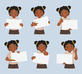 Little African girl holding blank poster in various facial expressions and hand gestures, include like, thumb up, finger pointing