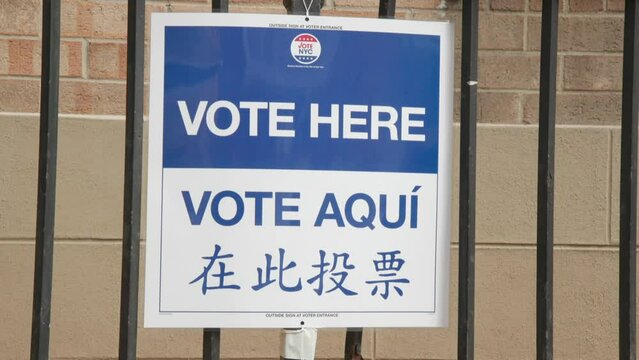 Vote here sign in English, Spanish and Mandarin. Part of the Vote NYC campaign outside a voting center in New York before the 2020 election.