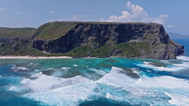 Drone pan view of Fronton beach and white foams in Las Galeras Samana, Dominian Republic