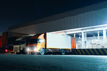 Trucks Loading Goods at Warehouse Port at Night. Trucks Loading Dock Warehouse. Supply Chain Warehouse Shipping, Cargo Shipment. Freight Truck Logistic, Cargo Transport.