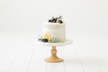 natural white cake with lemon blueberry garnish