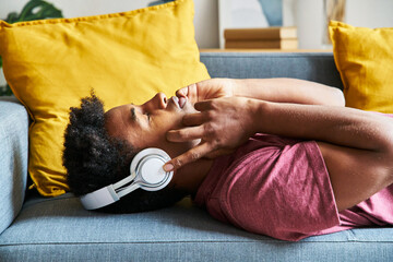 Side portrait of a relaxed man listening to music