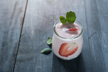 Healthy food of yogurt, Strawberry Yogurt,yogurt with fresh strawberry, wood background