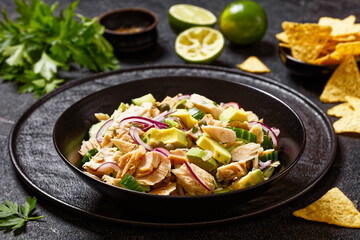 tuna salad with avocado, onion, cucumber, capers