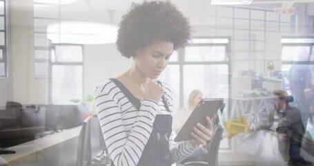 Animation of biracial businesswoman with tablet over cityscape - Powered by Adobe