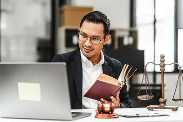Handsome businessman lawyer of Indian descent. trusted litigation lawyers attorneys. most commonly...