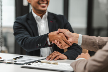 Two disgusting businessmen Asian lawyer of Indian descent paying attention to mistakes, proposing...