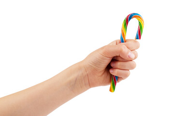 Hand holds striped chocolate wafer rolls