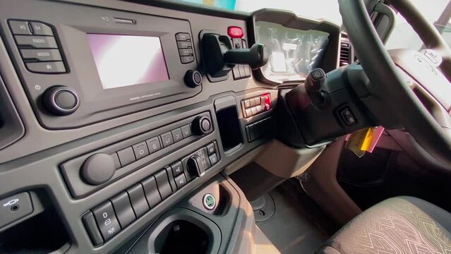 Dashboards of SCANIA P410 XT. Driver's cockpit and interior with steering wheel. Modern truck